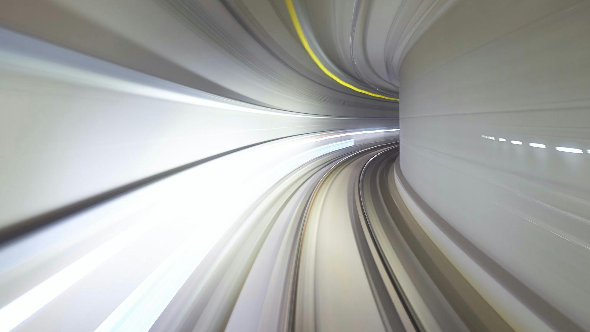 Abstract view through the front window of an autonomous subway going through a tunnel in Suwon, South Korea. Long exposure. Photo by Mathew Schwartz.